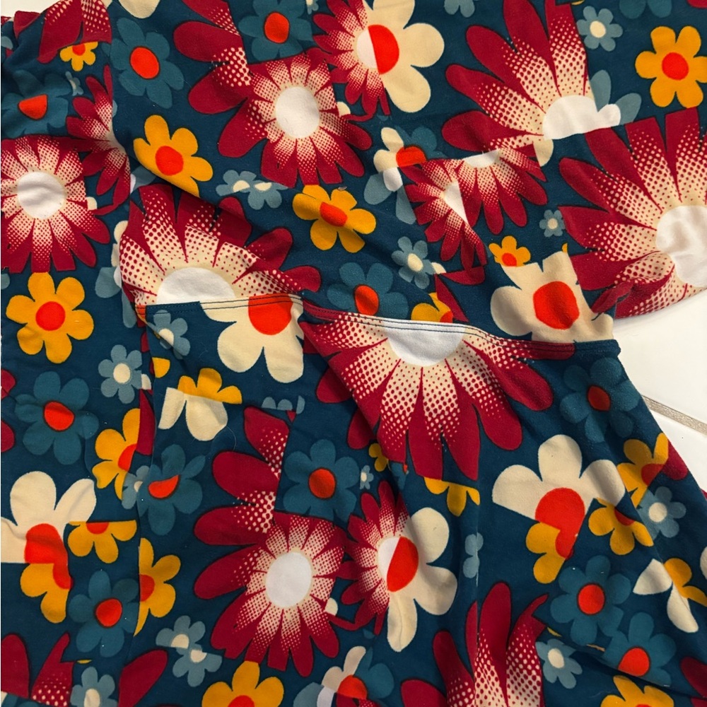 Vibrant Floral Fabric with Red and Yellow Blooms